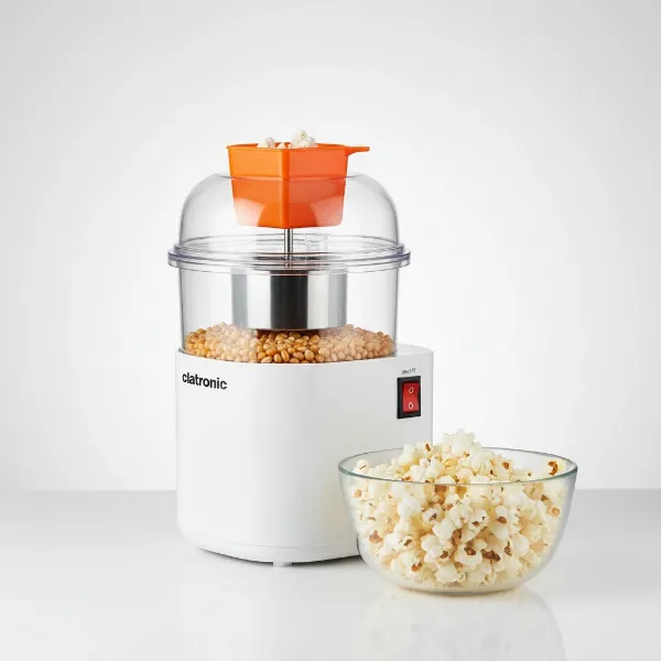 Clatronic PM 3635 hot air popcorn maker with transparent lid, portioning tray, and on/off switch.